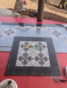 Our technicians carefully replacing a damaged floor tile in a commercial/residential environment in Los Ranchos de Albuquerque